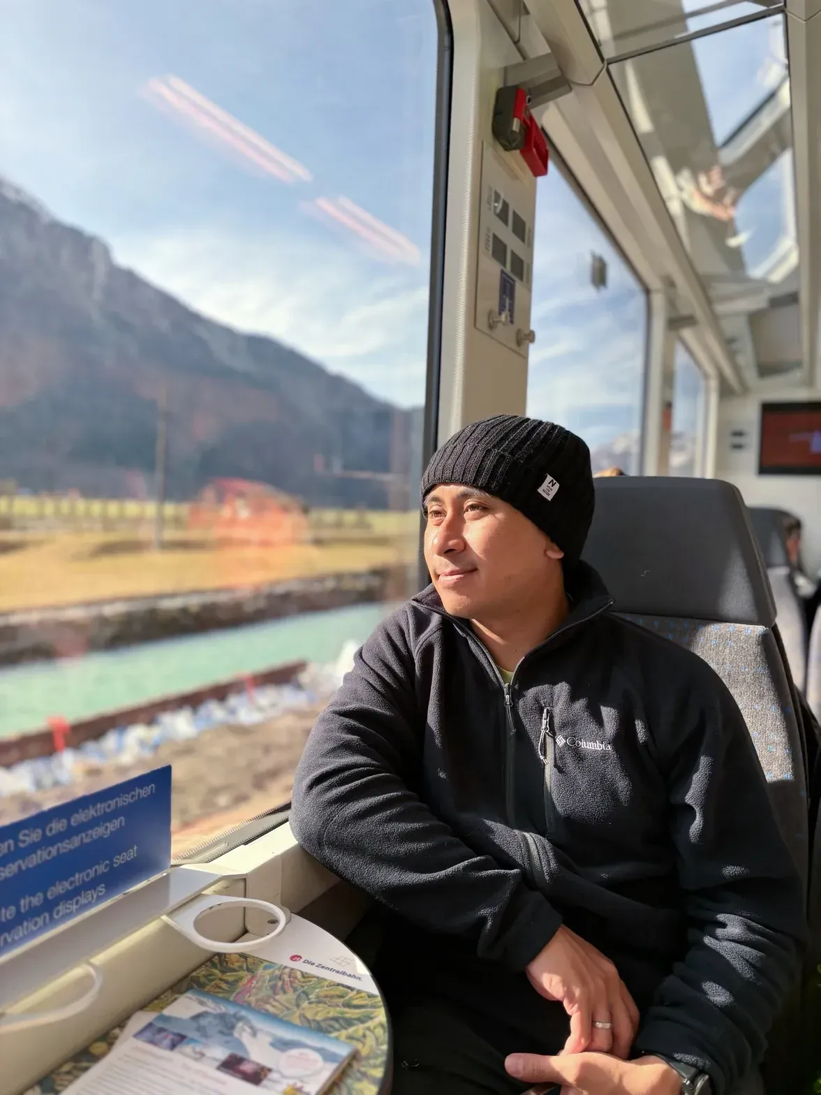 Risan Bagja looking out the train window
